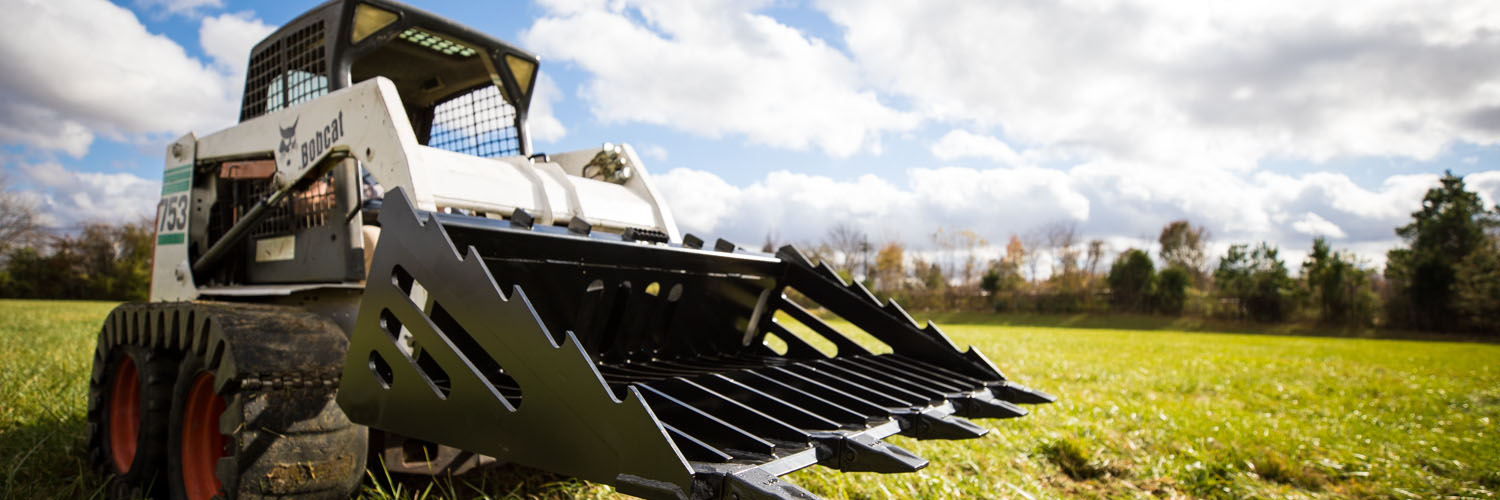 Skid steer in a field